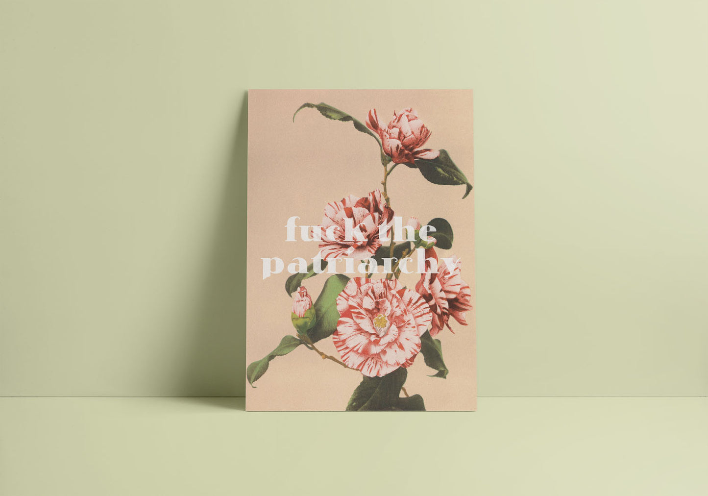 A minimalist decor with a vintage inspired feminist poster on a light colored wall features "Fck the patriarchy" in stylized letters.