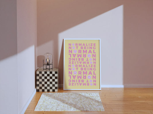 A soft sunlighted room with framed poster for non-normative affirmation. A coral vase sits on a checkered cube next to it for a minimalist room decor