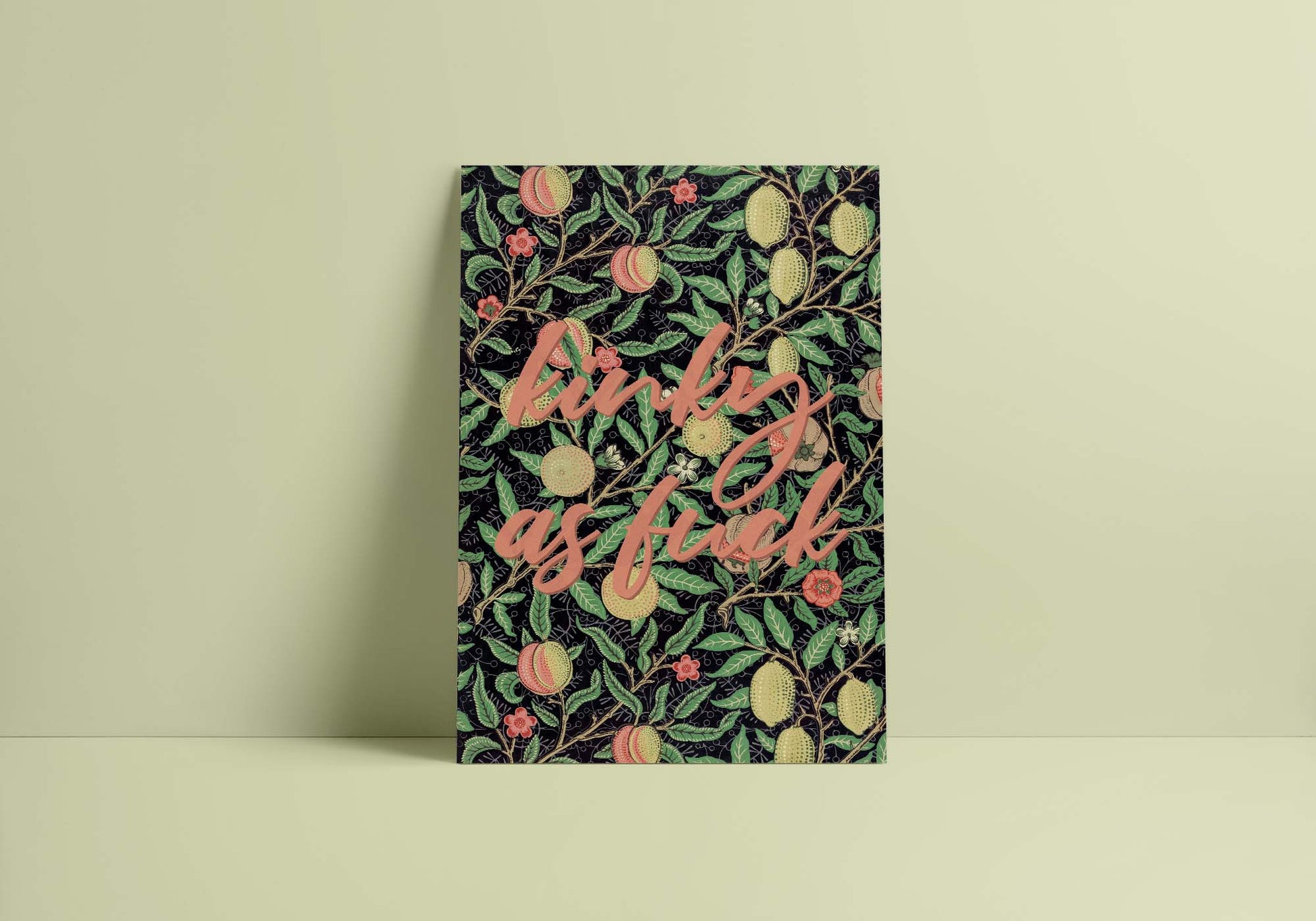 A minimalist decor with a colourful poster on a light green wall features a bold and colorful quote in stylized letters.