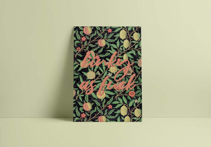 A minimalist decor with a colourful poster on a light green wall features a bold and colorful quote in stylized letters.