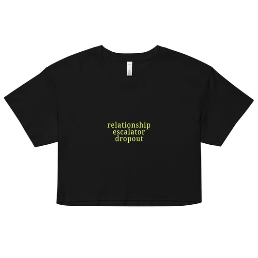 Crop top with bold Relationship Escalator Dropout yellow-green text for playful ENM and relationship anarchy affirmation