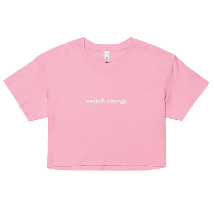 Crop top with cream text saying “Switch Energy” for versatile, play-friendly statement wear and bold expression.