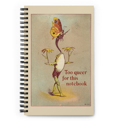 Vintage-style spiral notebook featuring a frog and butterfly with the text “Too Queer for This Card” for LGBTQ creatives.