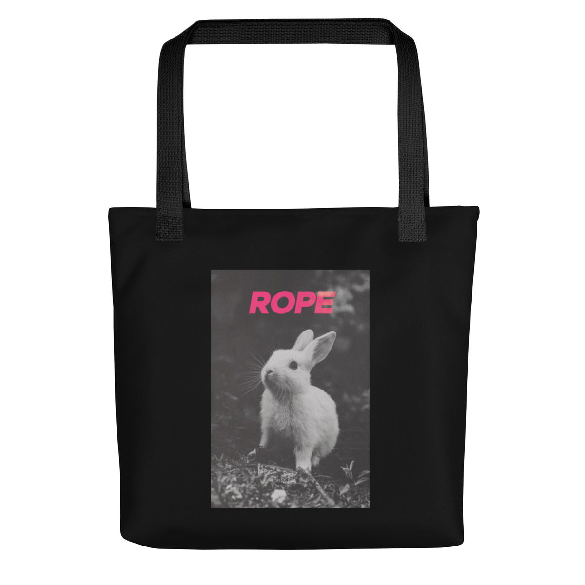 Black cotton tote bag with bold pink “ROPE” text and grayscale bunny illustration – playful, minimalist nod to alternative expression and rope art.