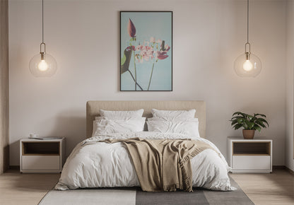 Cozy bedroom with a bed, white bedding, a throw, and a framed print on the wall displaying the phrase "Ethical slt" in a stylized font. Modern pendant lights and a plant on nightstands add warmth.