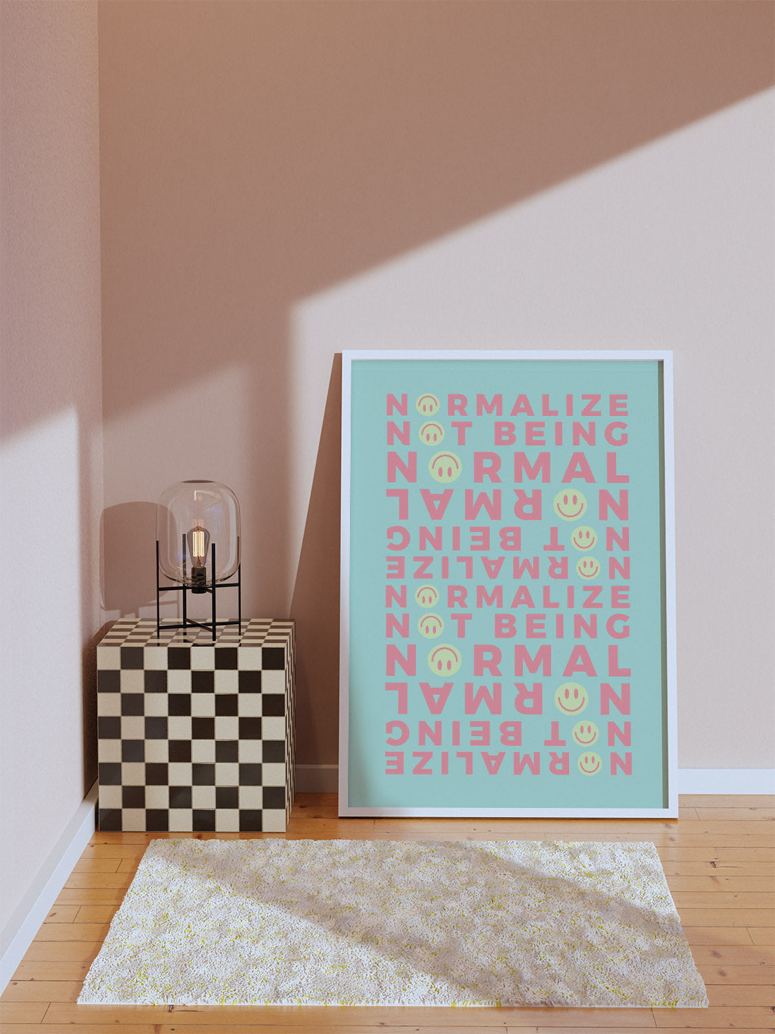 A minimalist room with soft sunlight. A framed print on the floor showcase an affirmation art in green. A coral vase sits on a checkered cube.
