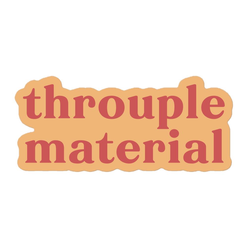 Vinyl sticker with light peach background and soft red text reading “throuple material,” polyamory pride decal for laptops, bottles, and journals. mockup