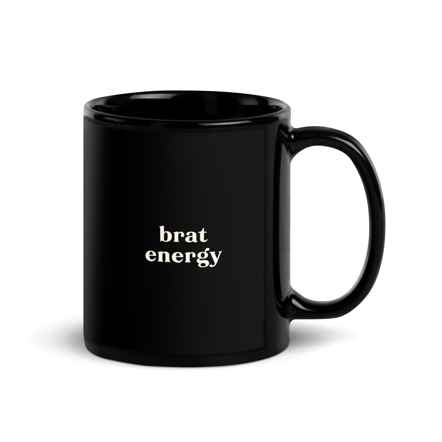 Black ceramic mug with cream text saying Brat Energy, for playful cheeky  affirmation coffee and tea cup