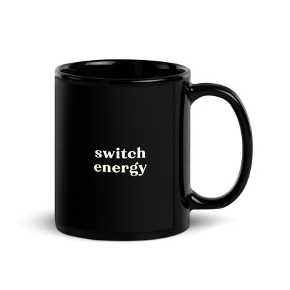 Black ceramic mug with cream text saying Switch Energy, for cheeky pleasure-positive pride morning coffee or tea