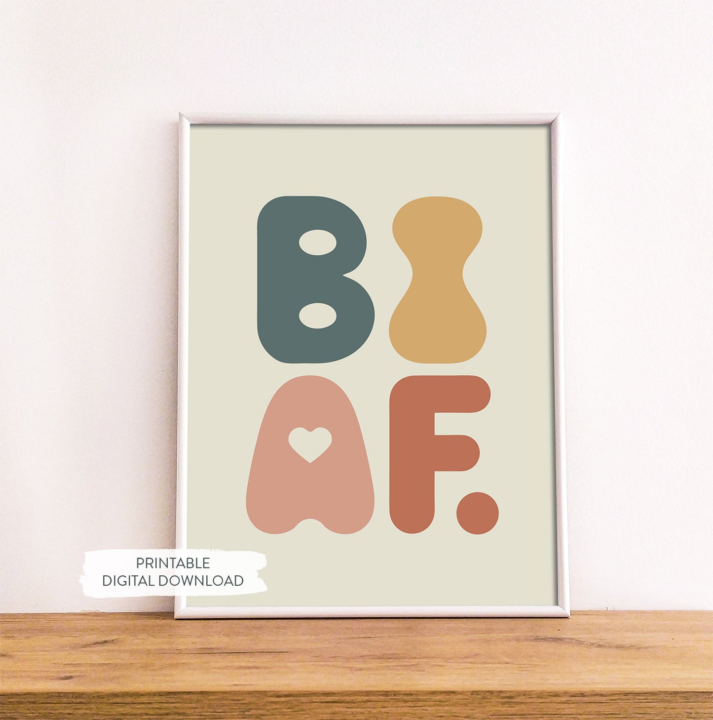 Bisexuality pride printable poster ‘BI AF’ shown in white frame on wood shelf