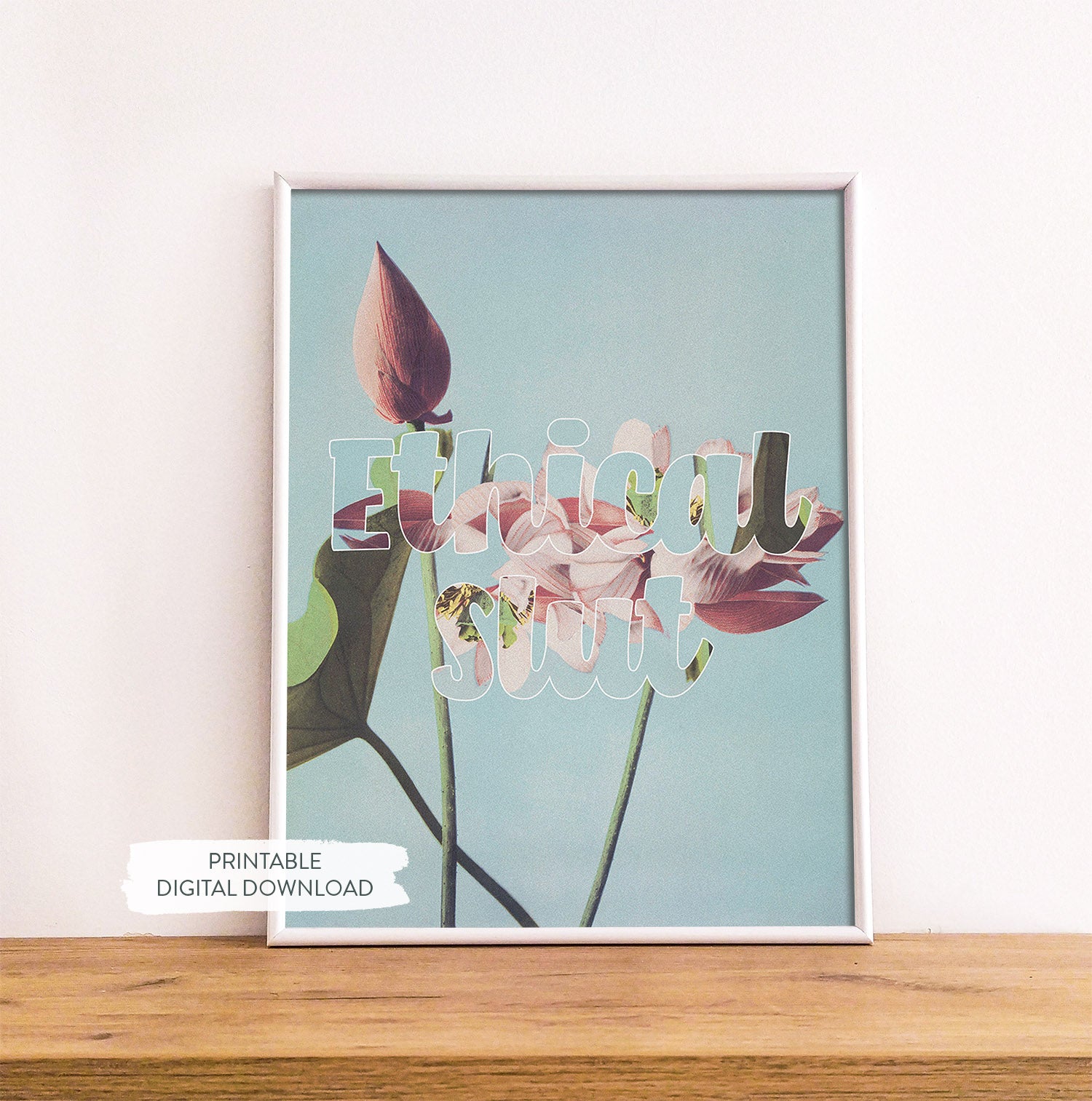 Sex-positive printable poster ‘Ethical slt’ shown in white frame on wood shelf