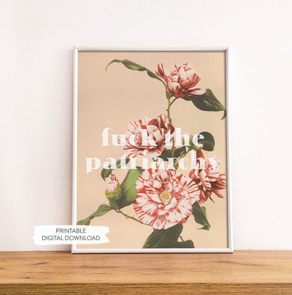 Feminist printable poster ‘Fck the Patriarchy’ shown in white frame on wood shelf