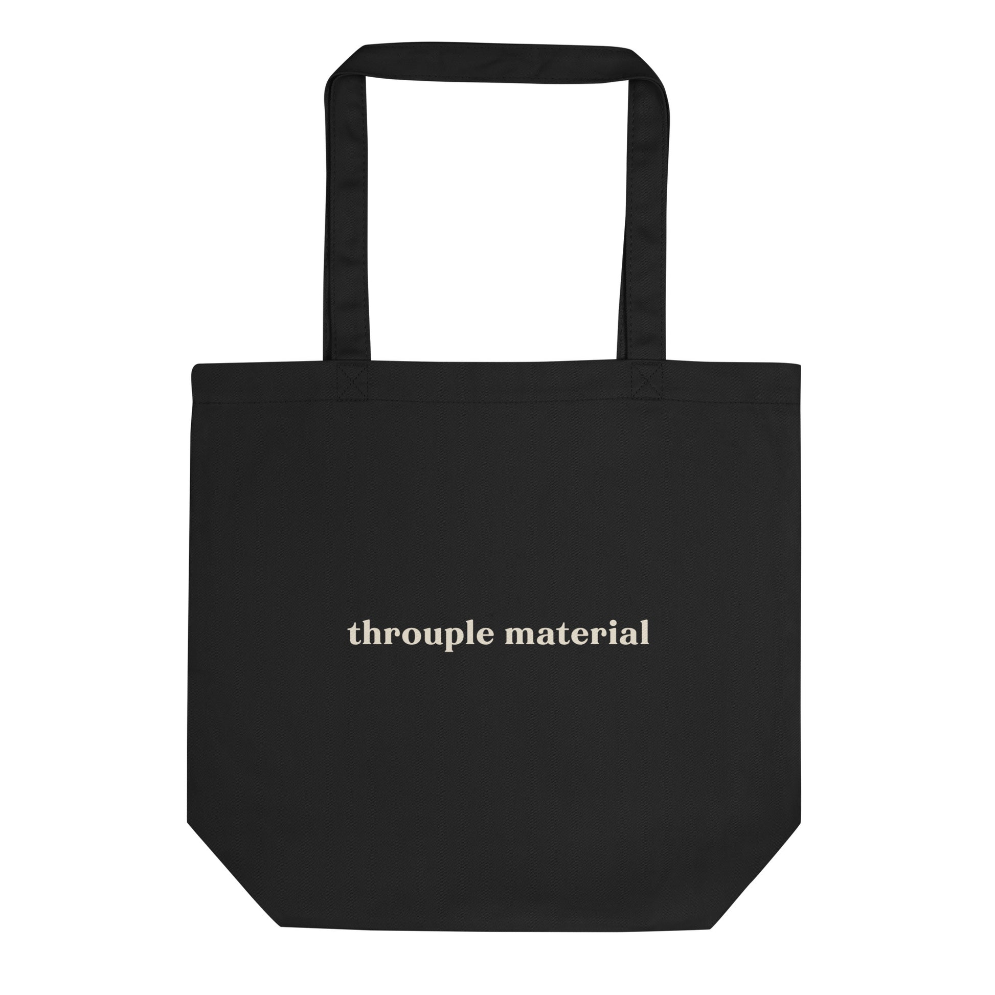 Black eco tote bag with bold mustard “Throuple Material” text – non-monogamy statement accessory for polyamorous visibility and everyday ENM style