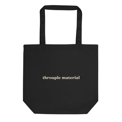 Black eco tote bag with bold mustard “Throuple Material” text – non-monogamy statement accessory for polyamorous visibility and everyday ENM style