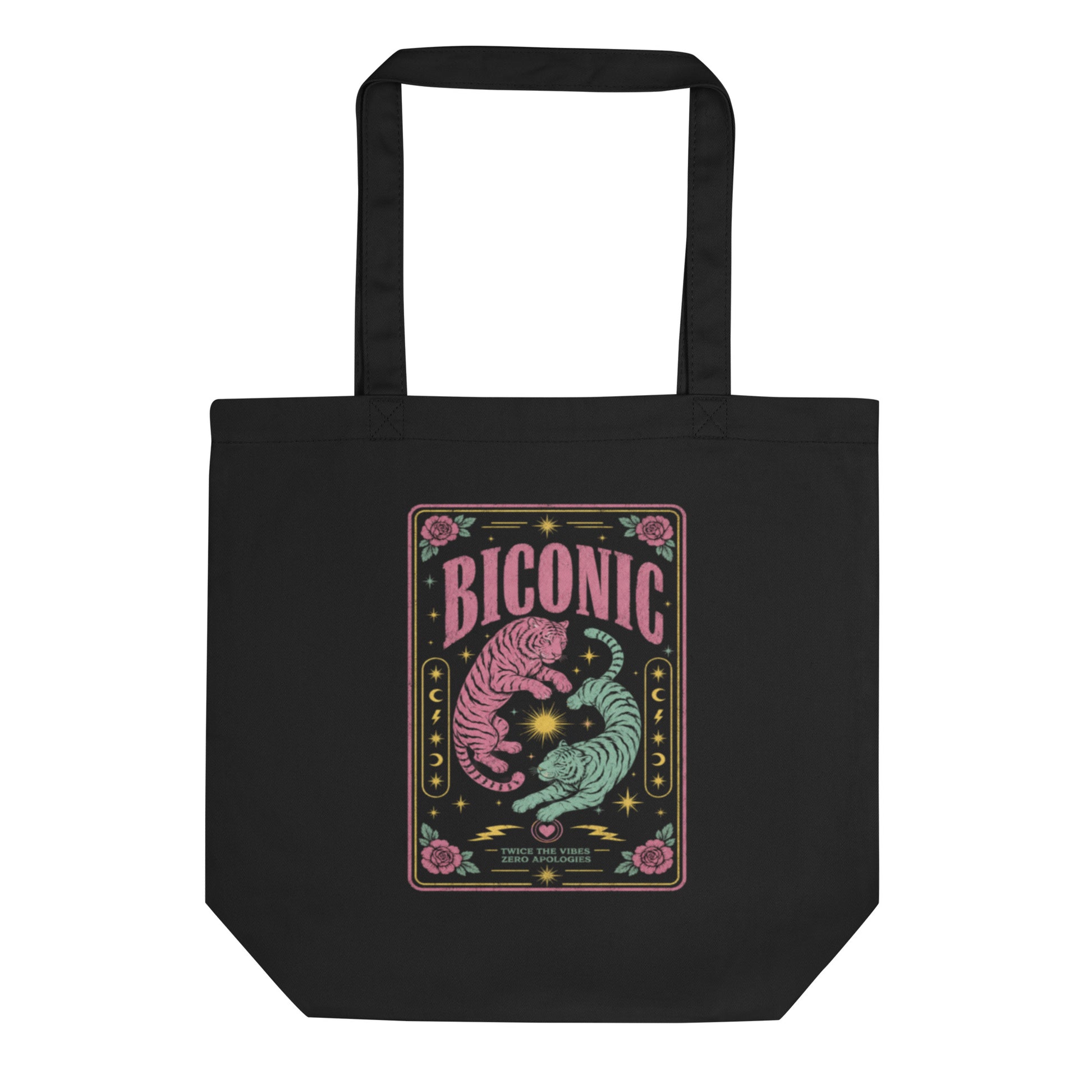 Black eco cotton tote bag featuring colorful pink and teal tiger artwork with the word "BICONIC," celestial motifs, roses and bisexual pride-inspired queer print.