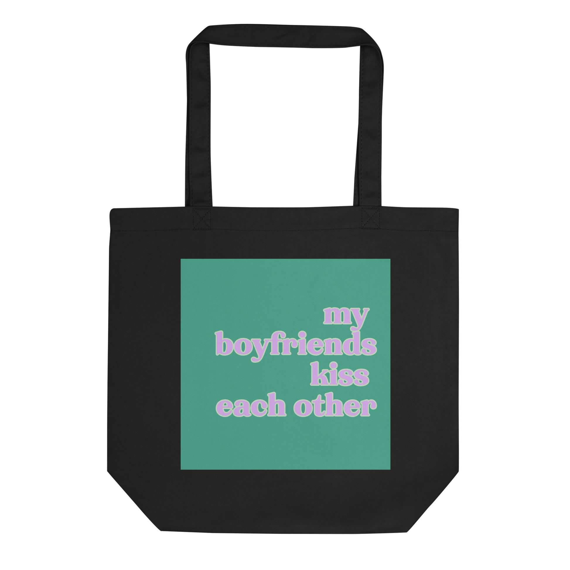 Black eco cotton tote bag featuring a mint green square design with pastel retro text reading “My Boyfriends Kiss Each Other,” celebrating queer polyamory and ENM humor.