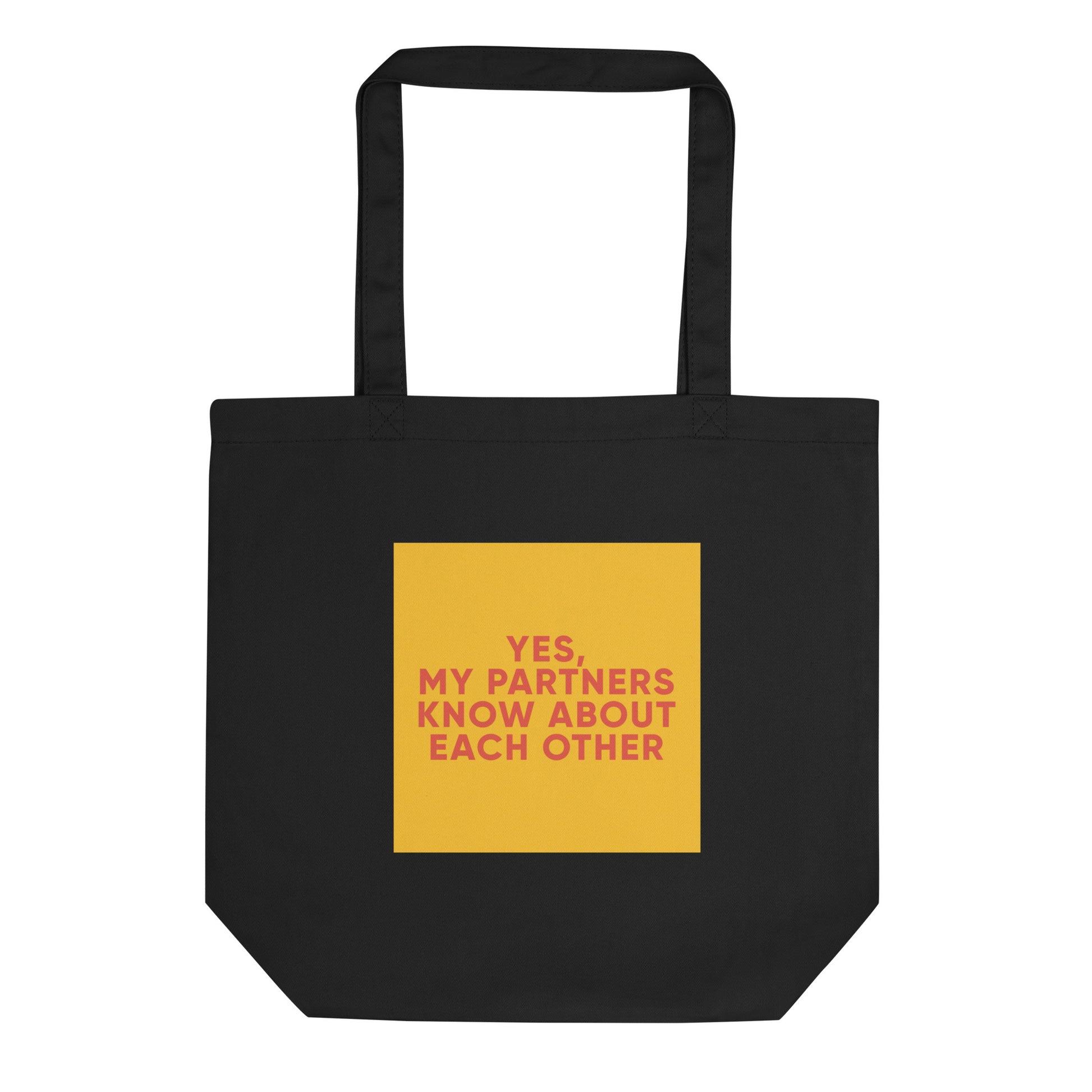 Black eco tote bag with a yellow-mustard square and bold orange-red text reading “YES, MY PARTNERS KNOW ABOUT EACH OTHER,” for ENM and polyam affirmation.