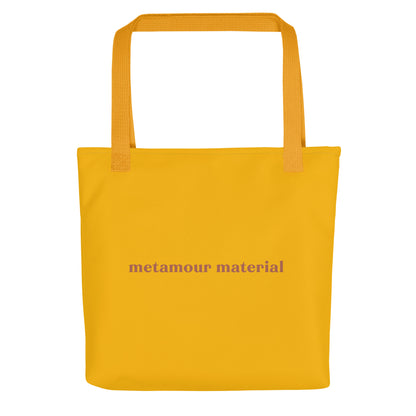 Mustard tote bag with terracotta “Metamour Material” text – stylish polyamory-affirming carryall for ENM visibility and kind-hearted vibes