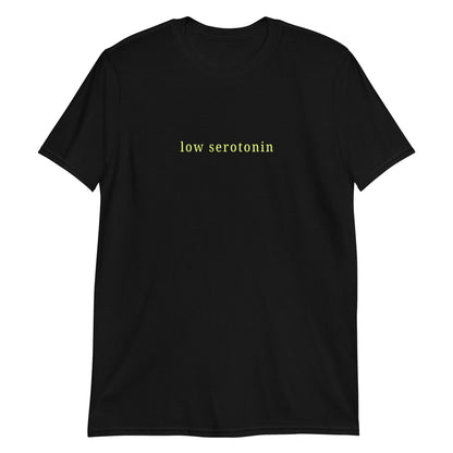 Unisex cotton t-shirt with yellow-green “low serotonin” text, sarcastic neurodivergent tee for everyday ADHD style.