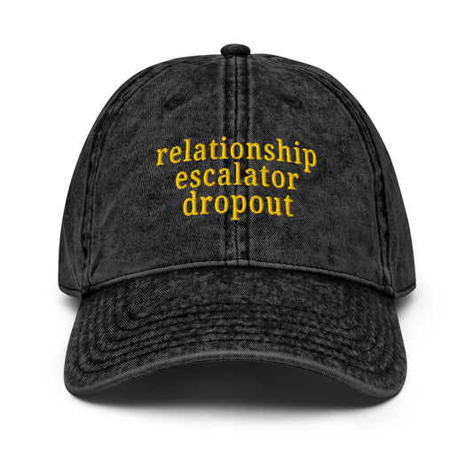 Vintage style cap with bold "Relationship Escalator Dropout" text for ENM and polyamory affirmation.