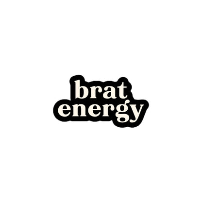 Vinyl sticker with cream text saying “Brat Energy” on black for playful personalities and cheeky statement style.