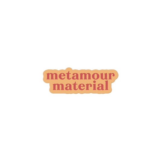 Vinyl sticker with light peach background and soft red text reading “metamour material,” supportive polyam vinyl decal for laptops and gifts.