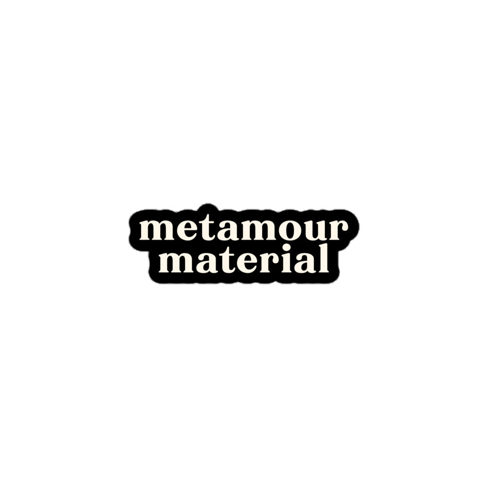 Vinyl sticker with cream text saying “Metamour Material” on black for polyamory supportive ENM pride.