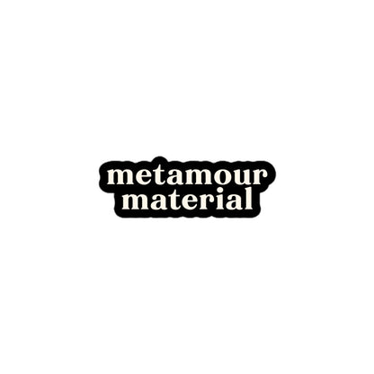 Vinyl sticker with cream text saying “Metamour Material” on black for polyamory supportive ENM pride.