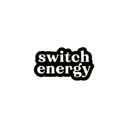 Vinyl sticker with cream text saying “Switch Energy” on black background for pleasure-friendly expression and flexibility pride.
