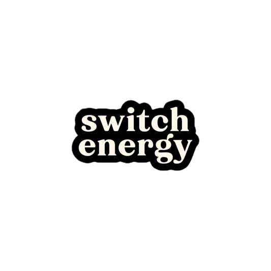 Vinyl sticker with cream text saying “Switch Energy” on black background for pleasure-friendly expression and flexibility pride.