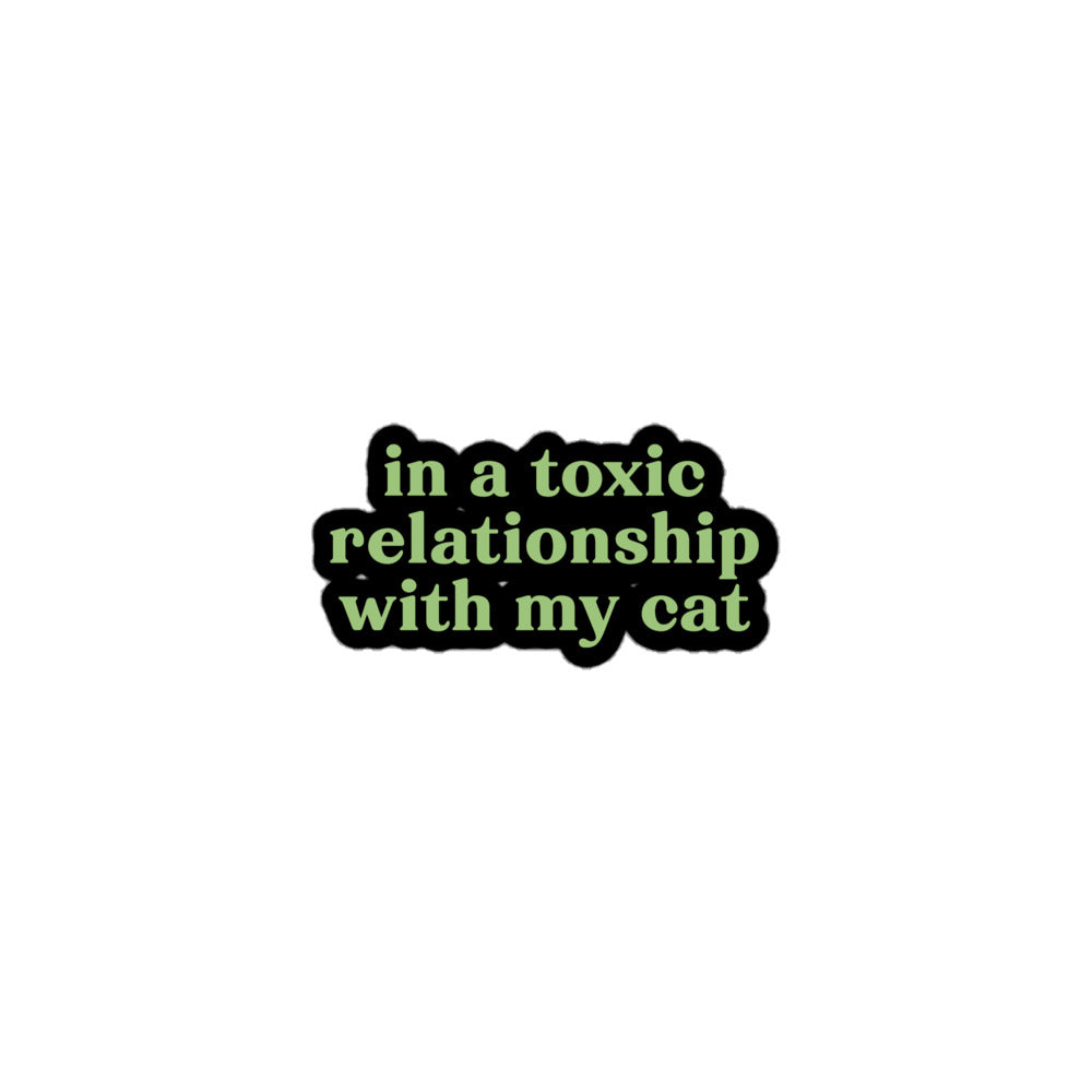 Vinyl sticker with green text saying “in a toxic relationship with my cat” for cat lovers with sarcastic dating dread.